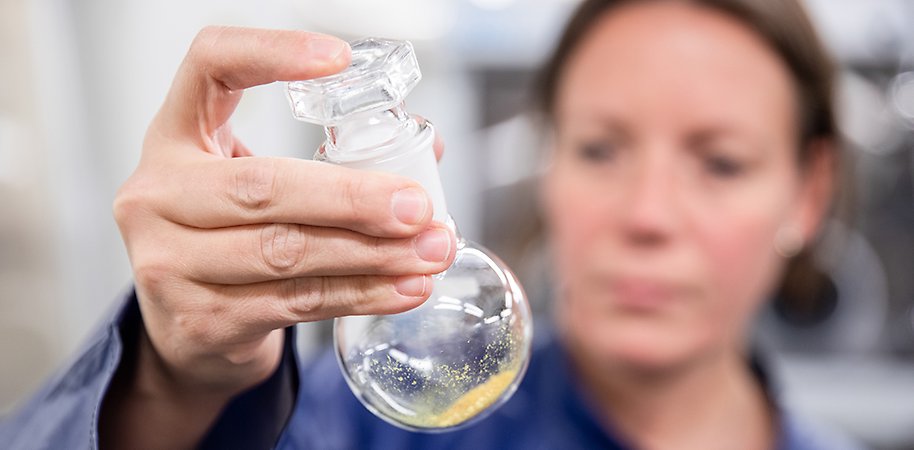 Person holding a test tube